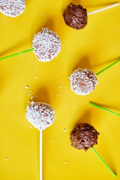 Flat lay homemade popcake coconut and dark chocolate cake pops