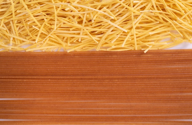 Flat lay image of varius tipe of pasta and spagetti for backgrounds and wall art