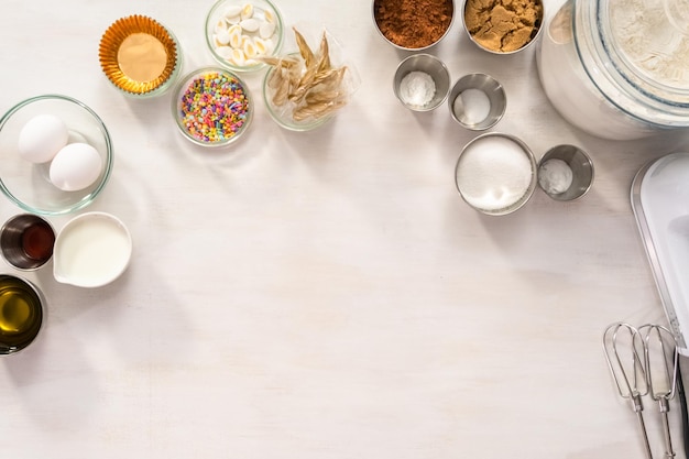 Flat lay. Ingredients for making chocolate unicorn cupcakes.