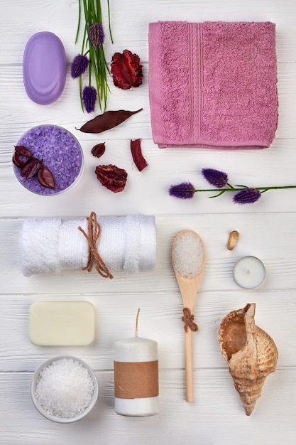 Photo flat lay many spa accessories on white wooden desk