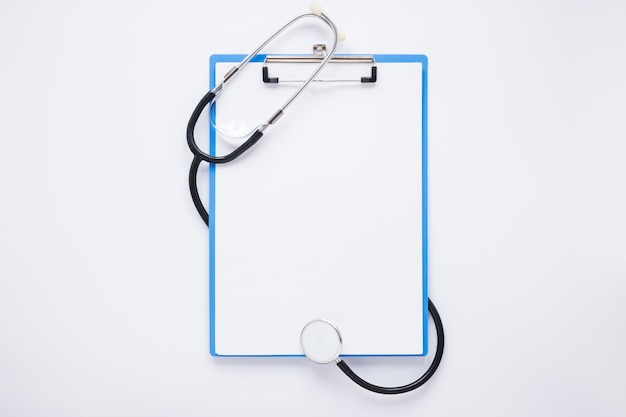 Flat lay medical composition with clipboard template