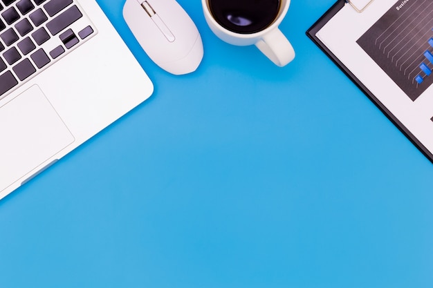 flat lay Office desk table of modern workplace with laptop on blue table