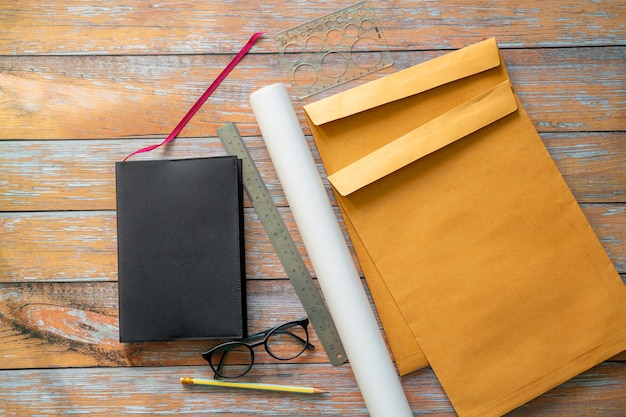 Flat lay of an office workplace with a smartphone coffee cup light bulb symbol made