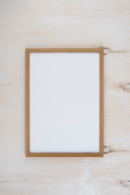 Flat lay of photo frame on textured surface