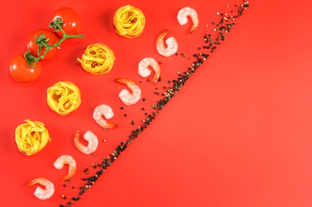 Flat lay photo of Ingredients for italian pasta on red background