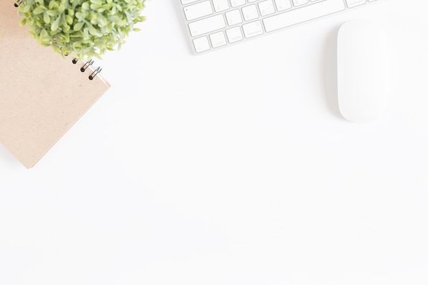 Flat lay photo of office desk with mouse and keyboard