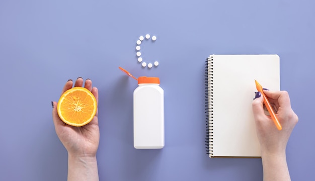 Flat lay pills on blue background vitamin c concept