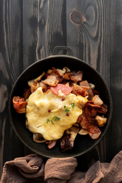 Flat lay of raclette dish with ingredients and delicious food