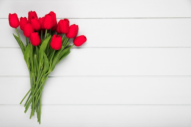 Flat lay red tulips bouquet with copy-space