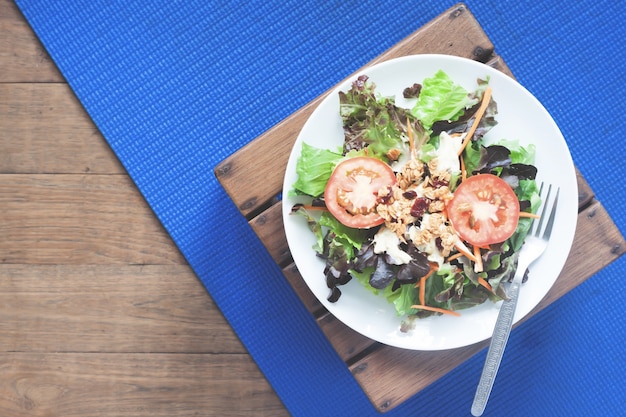 Flat lay of salad dish on yoga mat, Healthy eating