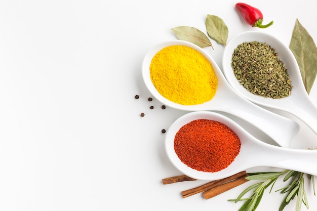 Flat lay spices powder on spoons 