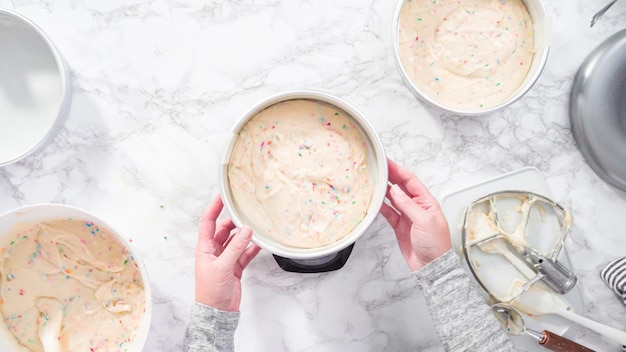 Flat lay. Step by step. Measuring funfetti cake batter on a digital kitchen scale.