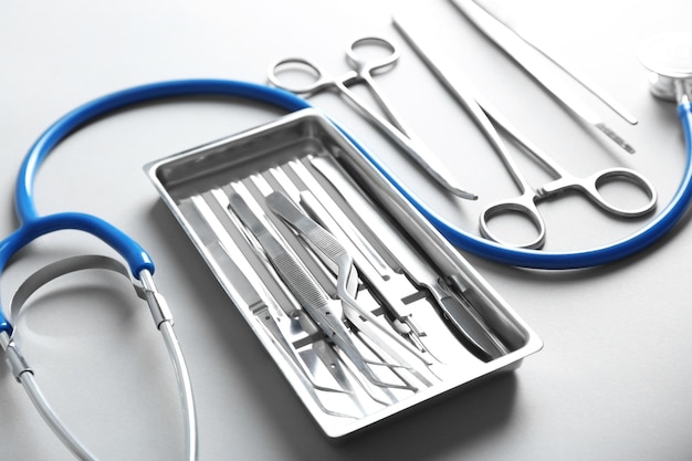 Photo flat lay of surgery instruments on white background