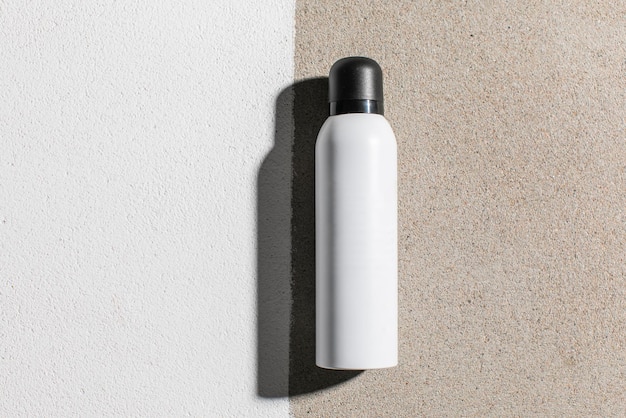 Flat lay top view mockup of white plastic aerosol tube with deodorant hairspray or other cosmetics