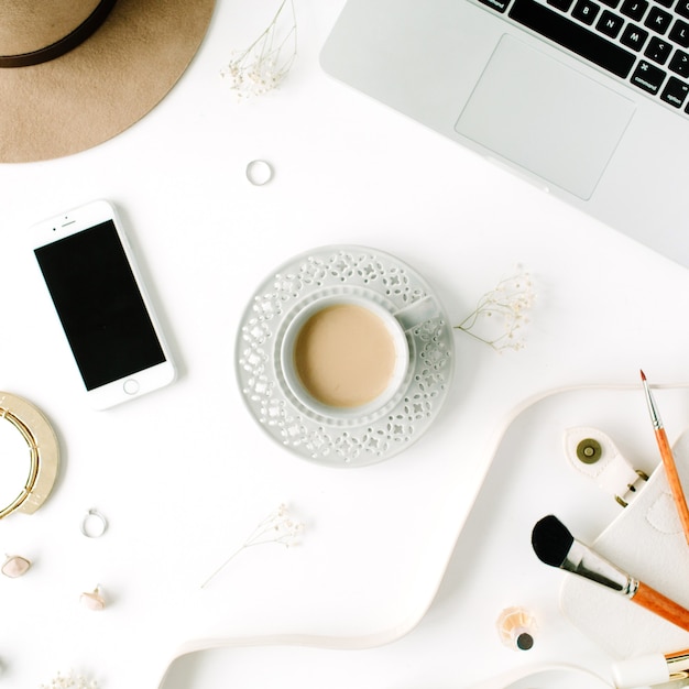 Flat lay trendy feminine home office workspace.