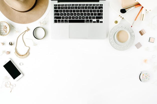 Flat lay trendy feminine home office workspace.