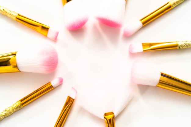 Flat lay. Unicorn-themed makeup brush set on a white background.