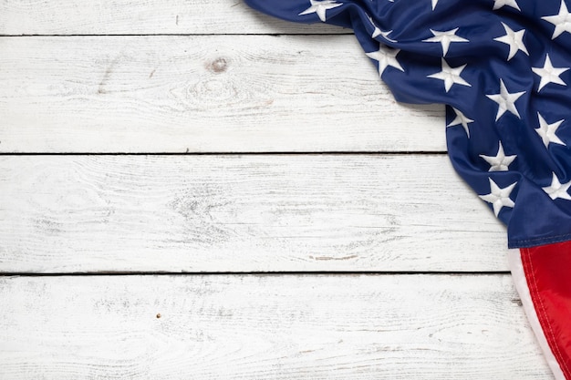 Flat lay USA flag on white wooden board vintage background with copy space top view Banner