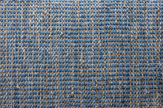 Flat lay view of blue color braided jute rug background texture concept