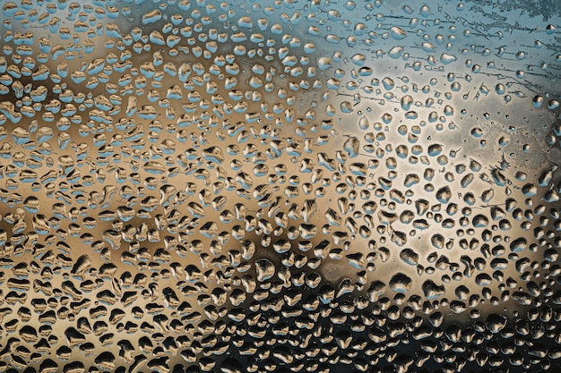 Flat lay water drops on a window background