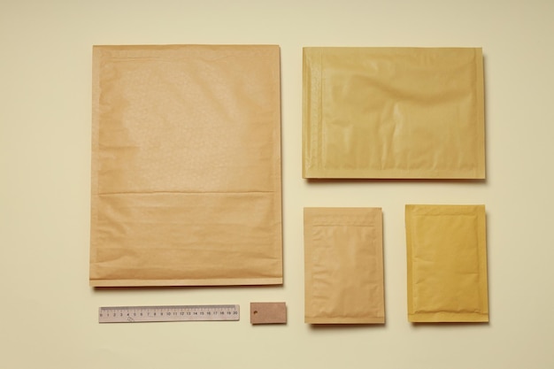 Flat lay with blank packages on beige background