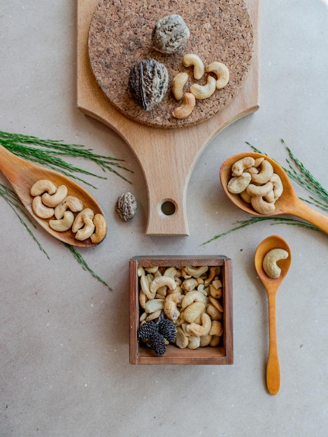 Flat lay with cashew nuts and wooden spoons