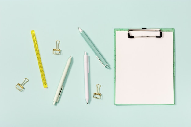 Flat lay with mock-up notebook and stationery for school or office.