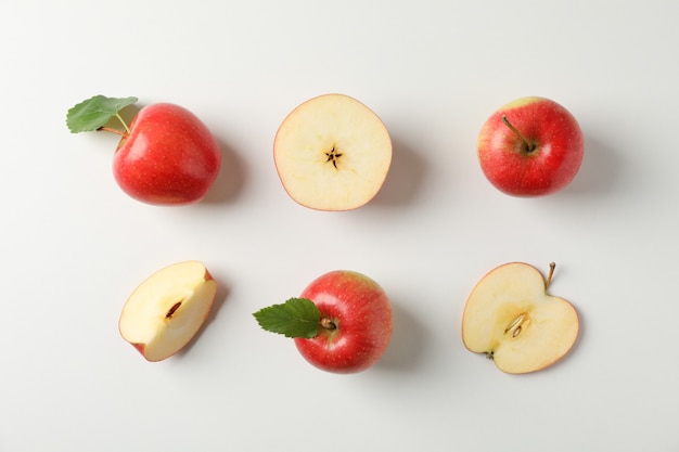 Flat lay with red apples on white table