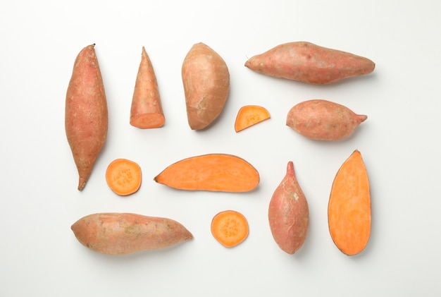 Flat lay with Sweet potatoes on white surface