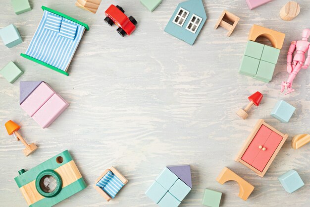 Photo flat lay with wooden  blocks in pastel colors. eco friendly, zero waste, plastic free, educational, gender neutral toys for children. copy space, top view