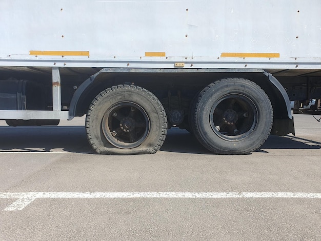 Flat tire of a heavy duty truck on the road