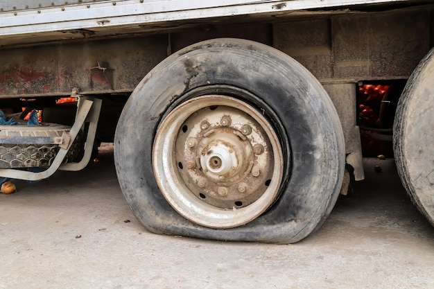 Flat tire of an old truck closeup