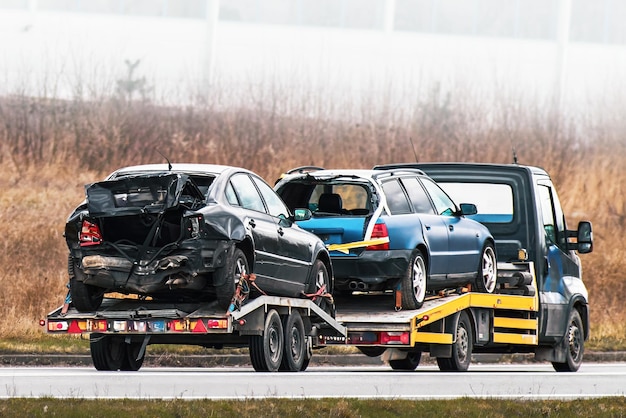 Photo flatbed tow truck in action roadside recovery 24 at 7 car service