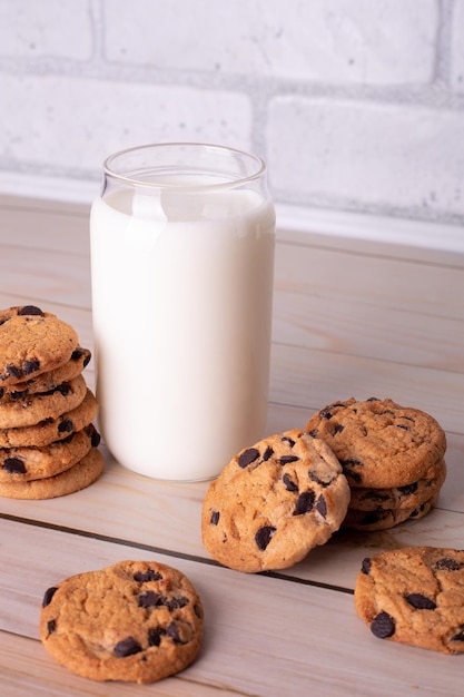 Flatlay an after school snack of chocolate chip cookies and an glass cup of milk