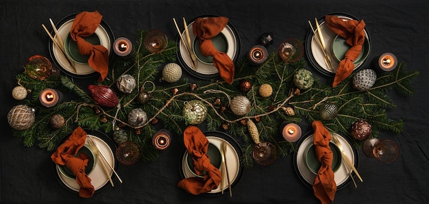 Flatlay of Christmas table setting on dark table