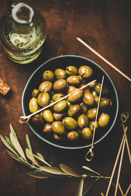 Flatlay of fresh harvested seasonal pickled green Mediterranean olives