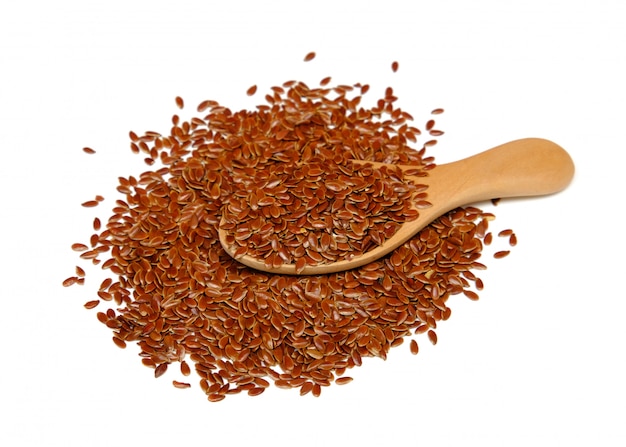 Flax seed on wooden spoon isolated on white background