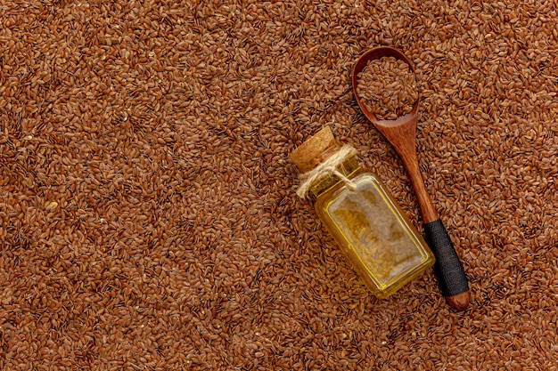 Flax seeds oil in small bottle. Linen extract, infusion in medicine jar