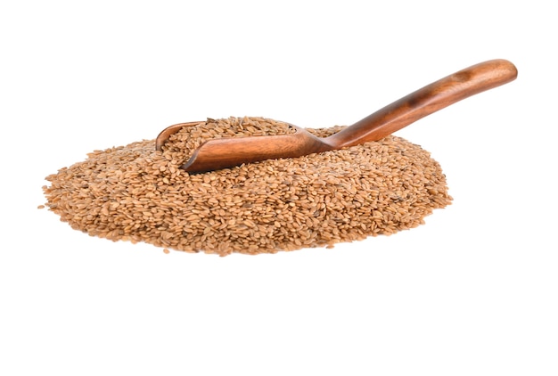 Flax seeds in a wooden spoon on white background