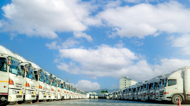 Fleet of trucks parked at parking lot yard of delivery company Truck transport Logistic industry