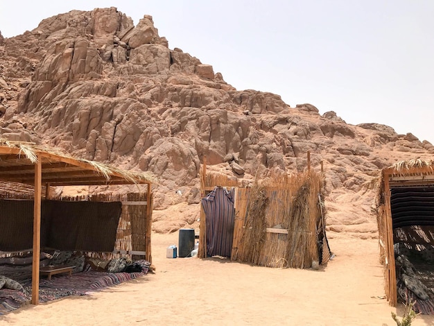 A flimsy dilapidated decrepit fragile fragile poor dwelling a Bedouin building made of straw twigs