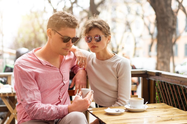 Flirting in a cafe Beautiful loving couple sitting in a cafe