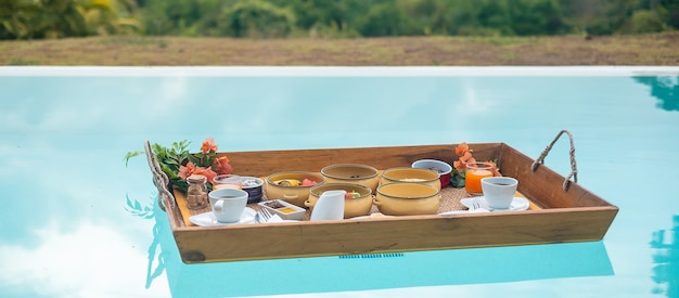 floating breakfast tray in luxury pool hotel