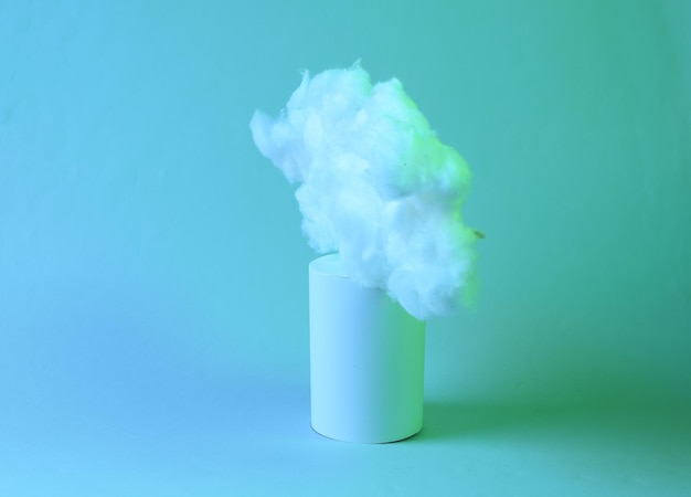 Floating fluffy cloud with cylinder in green blue neon gradient light Creative idea Creative art Minimalism