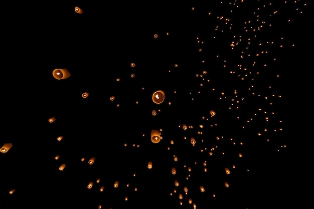 Floating lanterns in the night sky