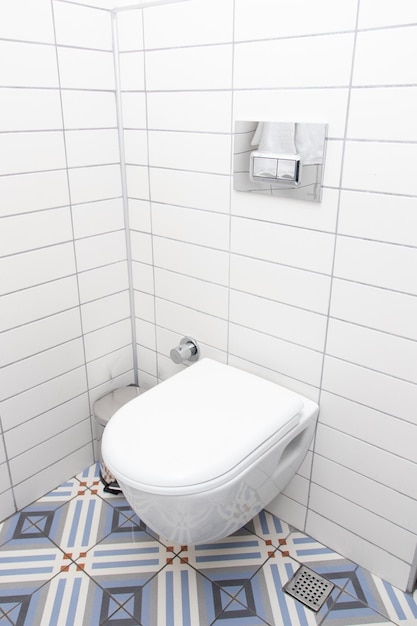 Floating toilet. Mounted toilet bowl in clean modern bathroom