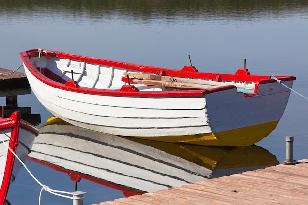 Floating Wooden Boat with Reflection