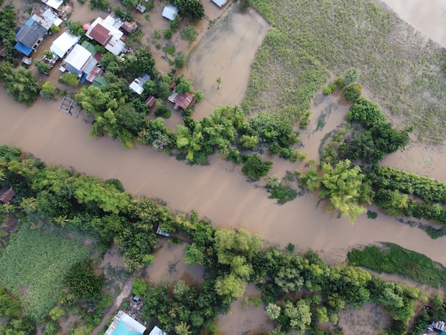 Flooding in rural communities in Thailand caused by storms causing heavy rains to continue