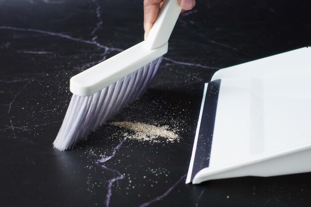 Floor dust with dust pan close up