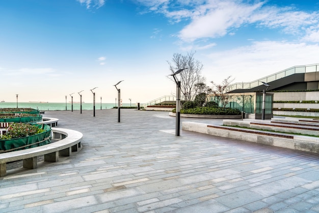 Floor tiles and seascape of city square